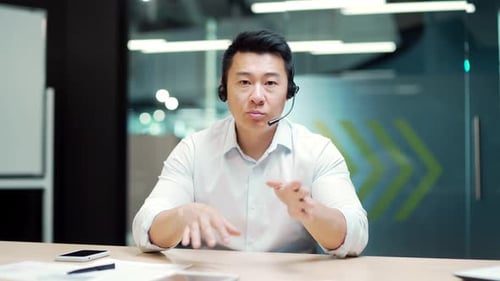 Professional Explaining with Headset in Office Environment