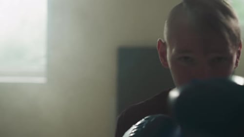 Sportsman Does Punches By Fists Training in Gym