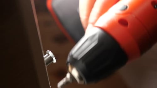 CloseUp of Electric Drill in Action During DIY Project
