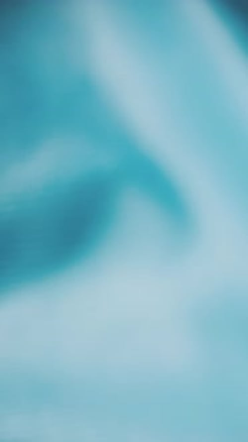 Close Up of Hand Touching Blue Patterned Fabric