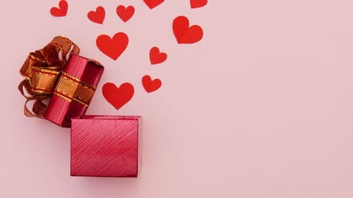 Gift Box Opens Revealing Floating Red Paper Hearts