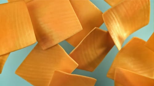 Sliced Cheddar Cheese Fly and Fall Filmed on a Highspeed Camera at 1000 Fps