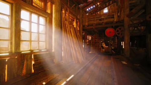 Sunlight Streaming Through Windows in a Rustic Wooden Barn Interior