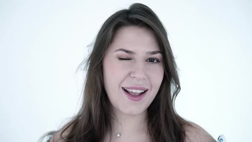 Woman Smiling and Winking at the Camera