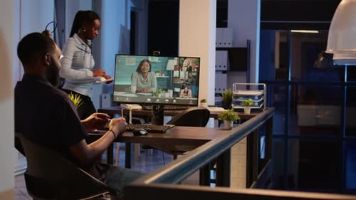 Office Worker Attending Business Meeting on Videocall Conference