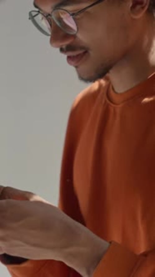 African American Male Student Chatting on Mobile Phone in University Corridor Guy Man Schoolboy