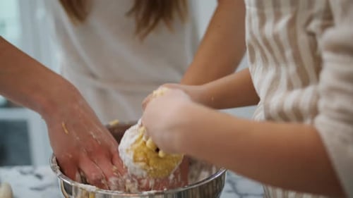 Mother Daughter Hands Kneading Dough Home Closeup
