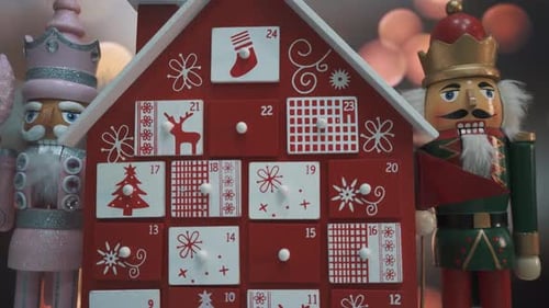 Wooden Tree Advent Calendar Decorated and Nutcracker Soldier Toys With Bokeh Blured BackgrWooden Tre