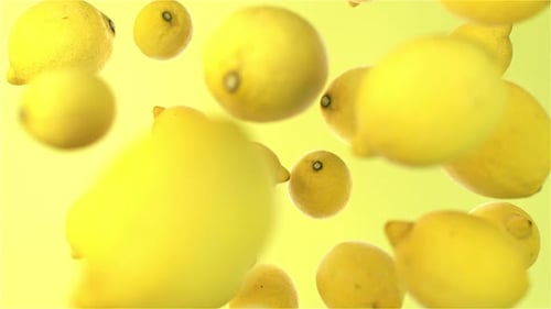 Dynamic Falling Lemons on Vibrant Yellow Background