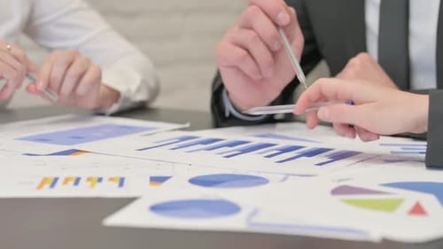Close up of Business People Working on Documents