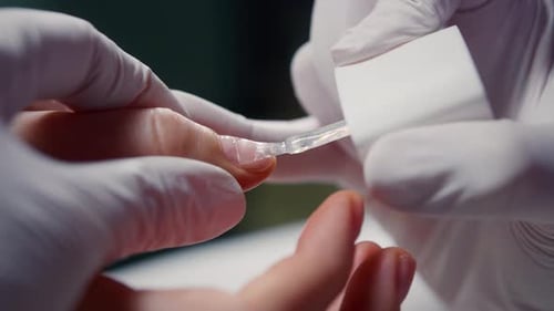 Manicurist Paints the Client's Nails with a Colorless Transparent Varnish Woman Takes Care Manicure