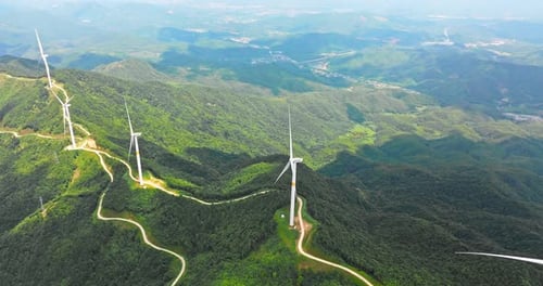 Wind Turbines Spinning on Mountain Ridges