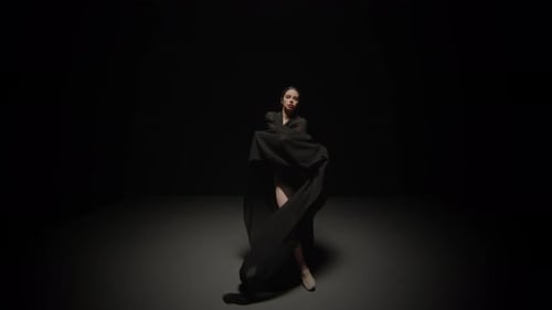 A Captivating and Dynamic Dance Performance Using Black Fabric