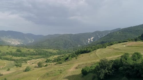 AERIAL: Wonderful view of a mountainous area covered in greenery.