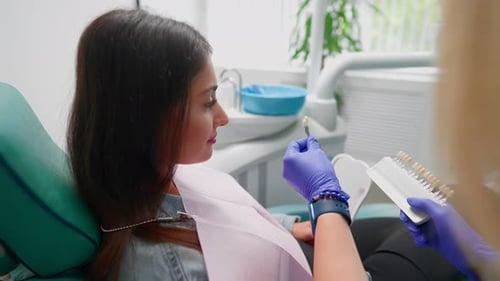 Woman Matching Tooth Shade at the Dentist