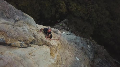 A Climber Tackles A Difficult Rock Face