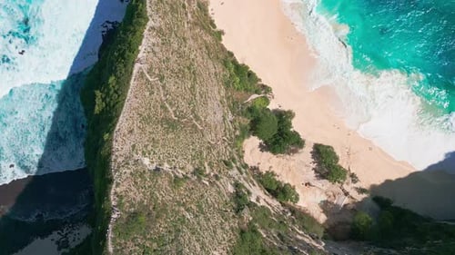 Aerial Flying Above Turquoise Sea Of Kelingking Beach With Limestone Cliff On Nusa Penida Island In
