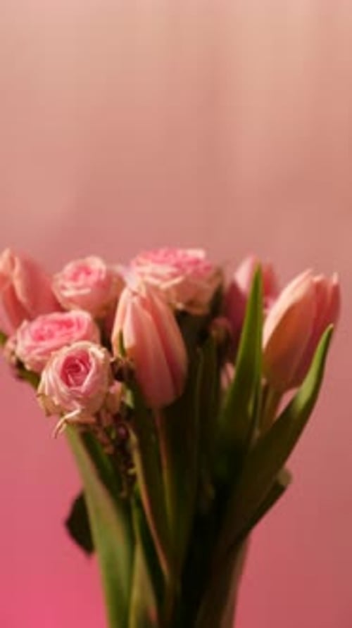 Bouquet of Pink Spring Flowers on a Neon Background