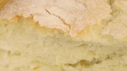 Wheat bread expanding, shot. Crust and breadcrums detail close up.