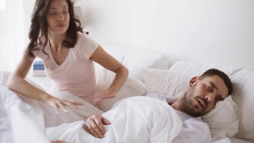 People, Snore And Problems With Sleep Concept - Angry Woman Waking Man Sleeping In Bed