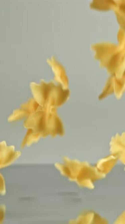 Super Slow Motion Dry Farfalle Pasta Filmed on a Highspeed Camera at 1000 Fps