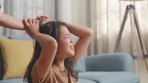 Asian Woman Victim Of Violence With Bruise On Body Abused By Man'S Hands Pulling Her Hair At Home