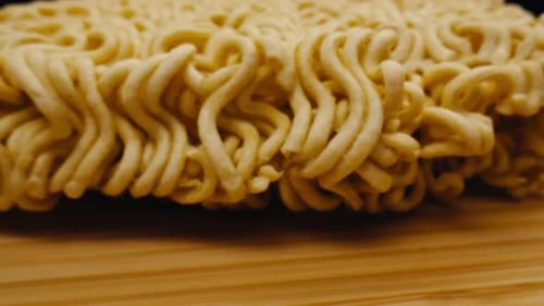 Close Up of Uncooked Ramen Noodles on Wood