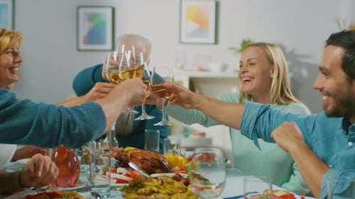 Family Celebrates Together at Dinner Table with Wine