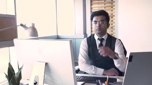 Man working at desk in modern office environment