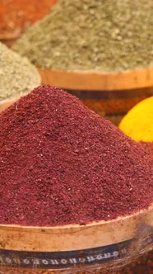 Experience the Vibrant Spices Displayed in Colorful Baskets at the Local Market Today