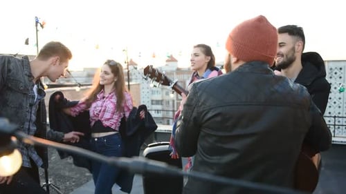 Friends Having Fun on a Rooftop with Music
