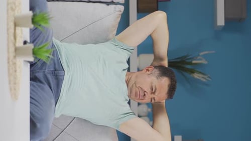 Vertical video of The sweating old man smells bad and offensive.