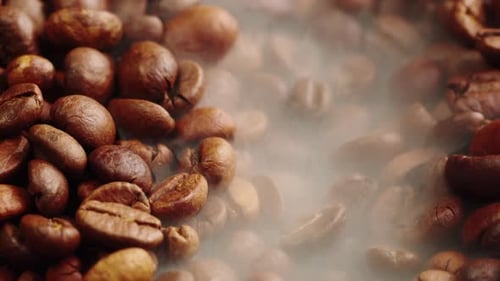 Roasting Coffee Beans with Smoke on Dark Background Close Up Arabica Robusta Colombian Beans
