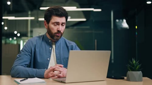 Bearded Man Engaged in a Video Call
