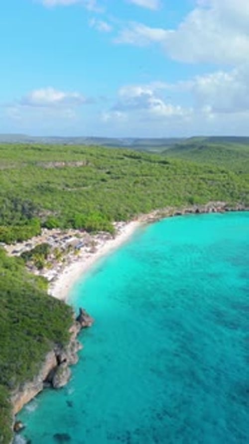Vertical aerial of Cas Abao beach with turquoise shoreline