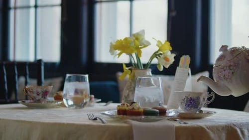 Elegant Tea is Poured at Formal Table Setting