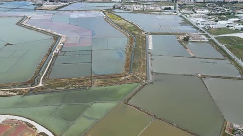Aerial Drone View of the Salt Pans of Trapani, Sicily – Windmills and Golden Reflections