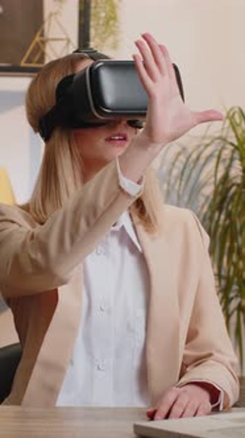 Woman Using VR Headset in Office Setting