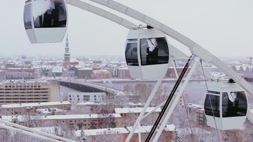 Riga Ferris Wheel Over Snowy Old Town Panorama in Winter Latvia Baltic City