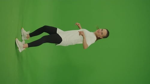 Vertical Video Female Dancer Performing a Dance on Green Screen Street Dancing