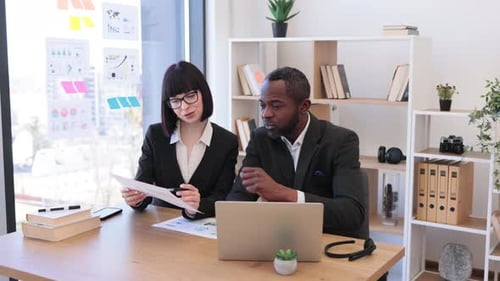 Diverse Office Workers Having Video Call on Laptop at Office