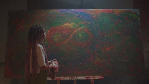 Artist Standing Before Large Abstract Painting