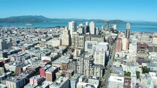 Golden Gate Bridge and San Francisco skyline with distant cargo ship view