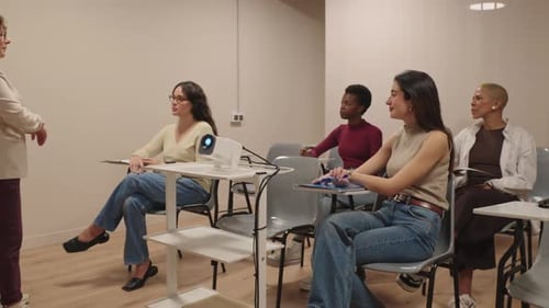 Women Attending Lecture in Classroom with Projector