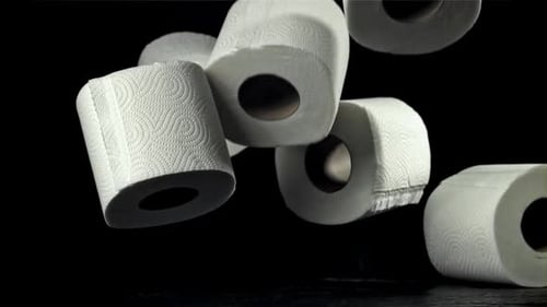 Toilet Paper Falls on the Table On a Black Background Filmed on a Highspeed Camera at 1000 Fps