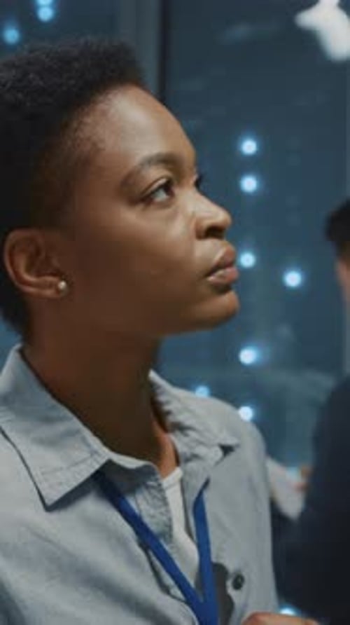 Young Adult Woman Working in a Server Room