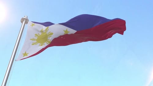 Philippines National Flag Waving Proudly in Blue Sky
