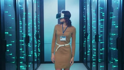 A Woman is Currently Wearing a Virtual Reality Headset in a Server Room