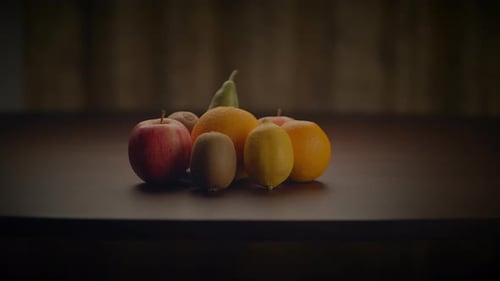 Static Arrangement of Various Fruits on Wooden Table