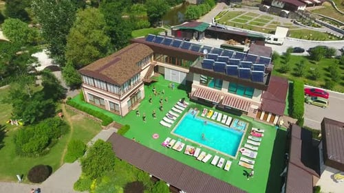 Holiday resort summer pool aerial view. Vacational outdoor swimming pool.